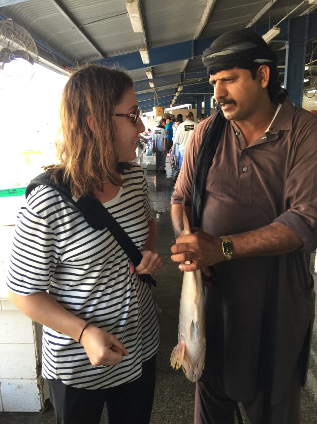 He is trying to talk me into holding the fish for the photo